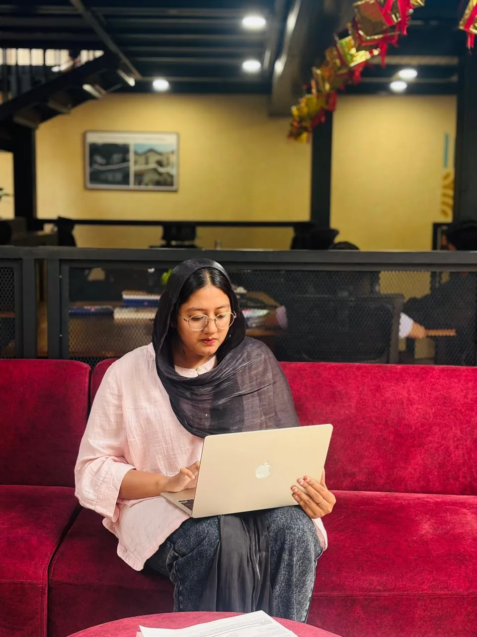 passionated best digital marketer in Saudi Arabia working on a laptop in a professional workspace